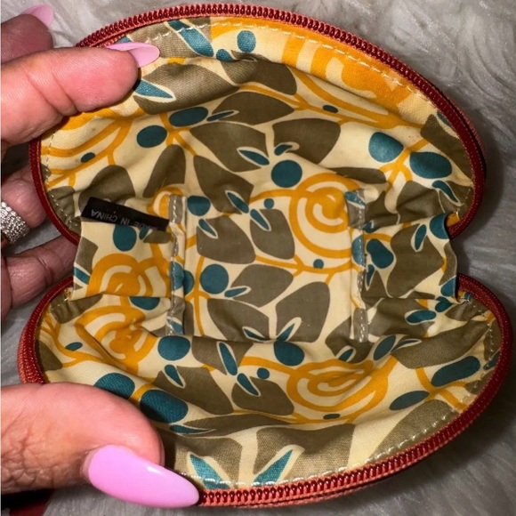 Fossil canvas cosmetic pouch featuring a floral pattern and a signature key fob - Picture 7 of 7